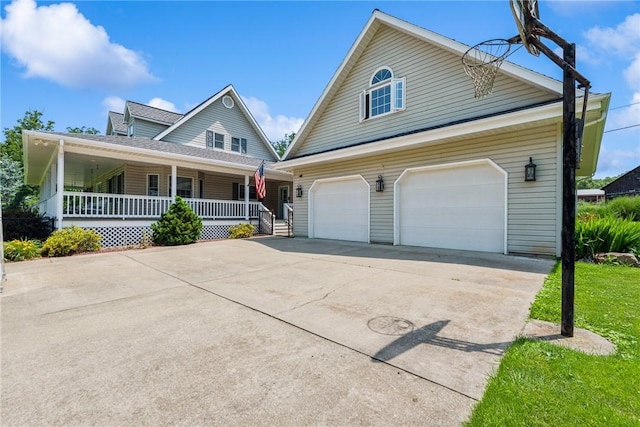 409 Park Rd, Bullskin Twp, PA 15683 - view of front facade with concrete driveway, covered porch, and a garage