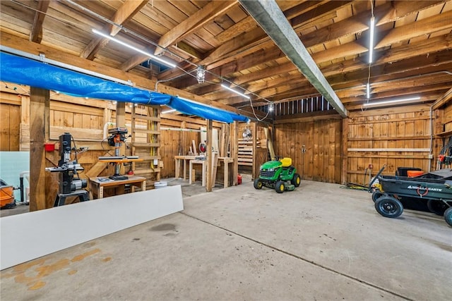 409 Park Rd, Bullskin Twp, PA 15683 - garage featuring wood walls and a workshop area