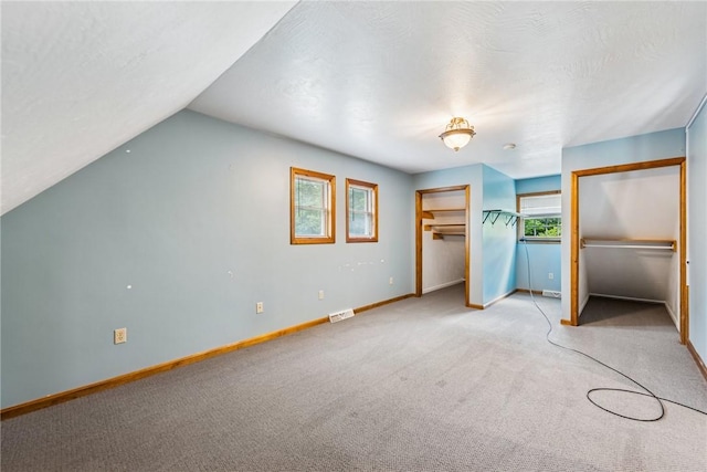 409 Park Rd, Bullskin Twp, PA 15683 - unfurnished bedroom with light colored carpet and lofted ceiling