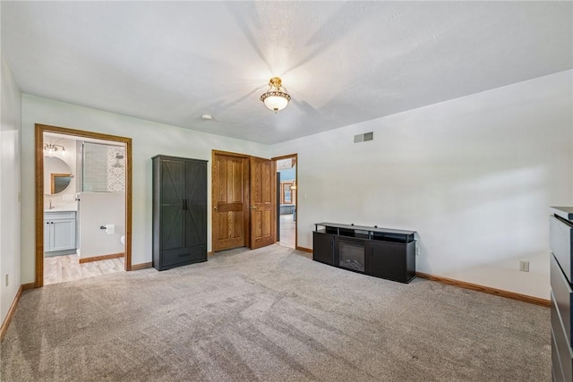 409 Park Rd, Bullskin Twp, PA 15683 - unfurnished bedroom with light colored carpet and ensuite bathroom