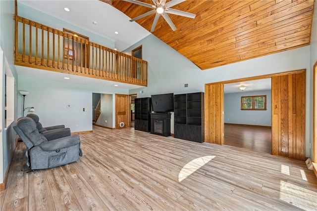 409 Park Rd, Bullskin Twp, PA 15683 - unfurnished living room featuring ceiling fan, high vaulted ceiling, wooden ceiling, light wood-style floors, and a glass covered fireplace