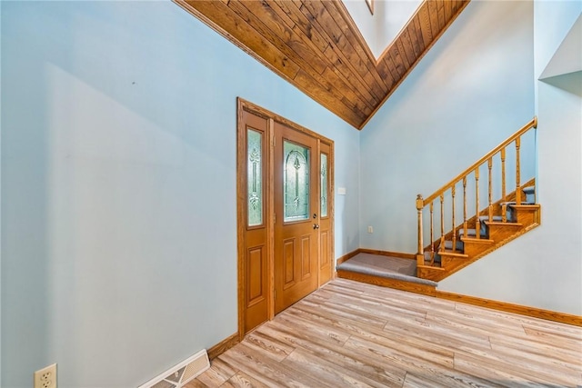 409 Park Rd, Bullskin Twp, PA 15683 - entrance foyer featuring wood finished floors, stairway, lofted ceiling, and a skylight