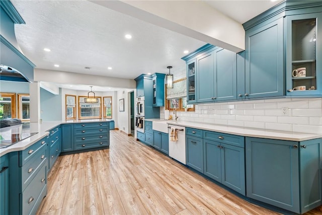 409 Park Rd, Bullskin Twp, PA 15683 - kitchen featuring dishwasher, light wood finished floors, plenty of natural light, backsplash, and recessed lighting