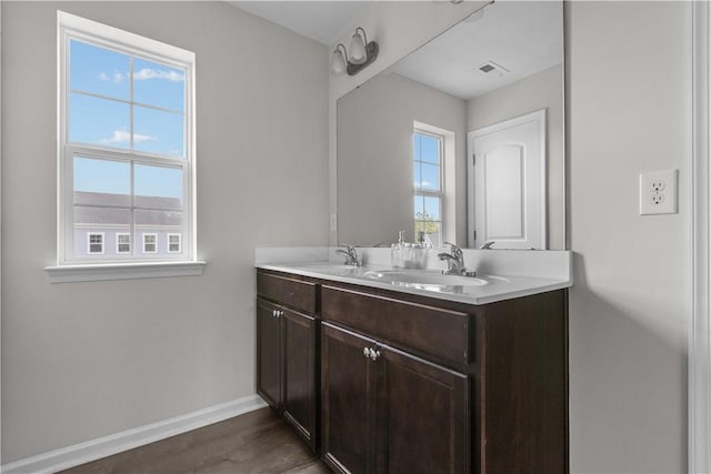 829 Frickwood Dr, South Park, PA 15129 - bathroom featuring double vanity and wood finished floors