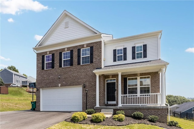 829 Frickwood Dr, South Park, PA 15129 - view of front facade with covered porch, brick siding, a garage, and asphalt driveway