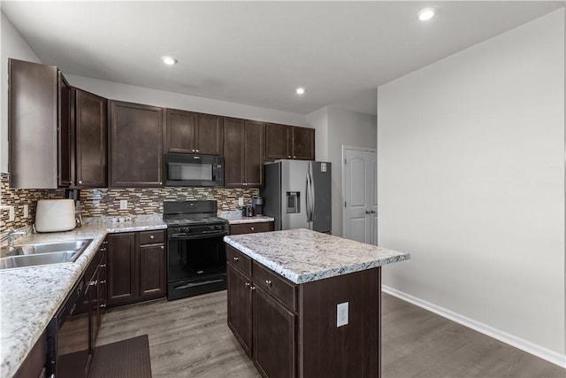 829 Frickwood Dr, South Park, PA 15129 - kitchen with black appliances, light wood finished floors, backsplash, and recessed lighting