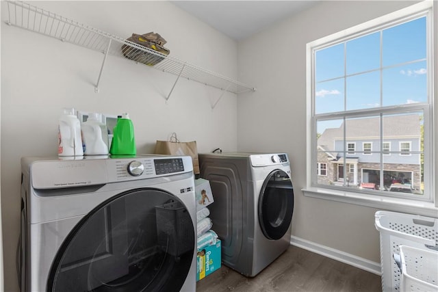 829 Frickwood Dr, South Park, PA 15129 - laundry room with washing machine and dryer, wood finished floors, and plenty of natural light