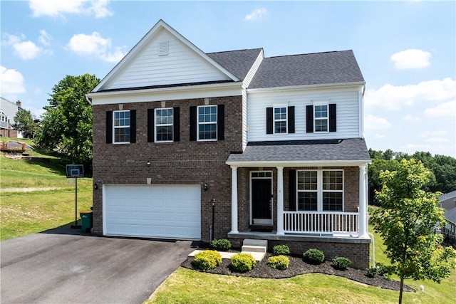 829 Frickwood Dr, South Park, PA 15129 - view of front facade featuring covered porch, asphalt driveway, brick siding, a garage, and a front yard
