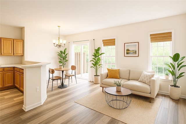 114 Southern Valley Ct, Adams Twp, PA 16046 - living room featuring light wood finished floors and a chandelier