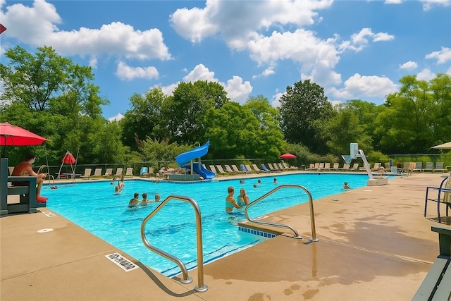 114 Southern Valley Ct, Adams Twp, PA 16046 - community pool featuring a water slide, a patio, and view of wooded area