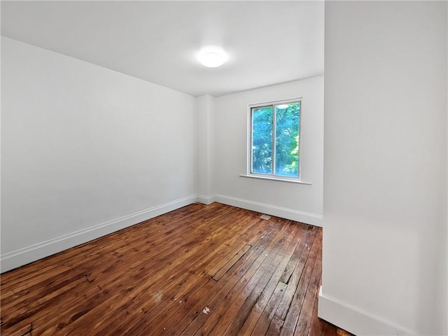 7304 Forest Way, Homewood-Brushton, PA 15208 - empty room with dark wood-style flooring and baseboards
