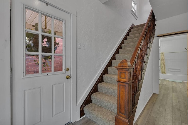 1104 Allegheny St, New Brighton, PA 15066 - staircase with wood finished floors and a textured wall