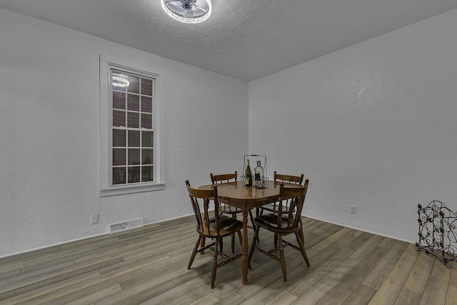 1104 Allegheny St, New Brighton, PA 15066 - dining room with wood finished floors and a textured wall
