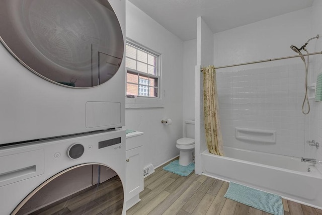 1104 Allegheny St, New Brighton, PA 15066 - bathroom with stacked washing machine and dryer, shower / bath combo, wood finished floors, and vanity