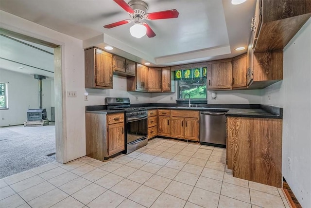 5028 W Smithfield St, Elizabeth Twp/Boro, PA 15135 - kitchen with stainless steel appliances, brown cabinetry, dark countertops, and recessed lighting