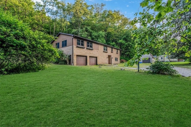 5028 W Smithfield St, Elizabeth Twp/Boro, PA 15135 - view of grassy yard with an attached garage
