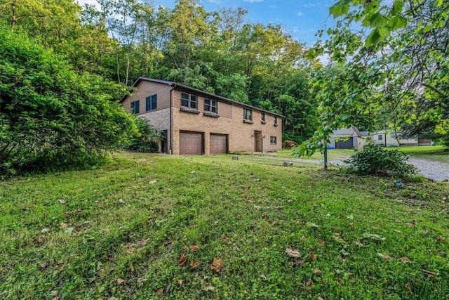 5028 W Smithfield St, Elizabeth Twp/Boro, PA 15135 - back of house featuring a garage and a yard