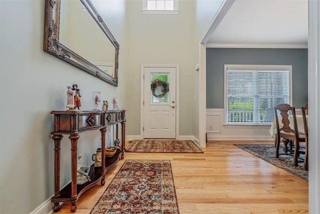 1303 Shinnecock Ct, Adams Twp, PA 16046 - foyer with plenty of natural light, wood finished floors, and crown molding
