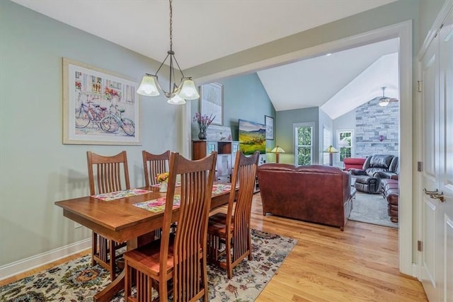 1303 Shinnecock Ct, Adams Twp, PA 16046 - dining space with a chandelier, light wood-style flooring, and lofted ceiling
