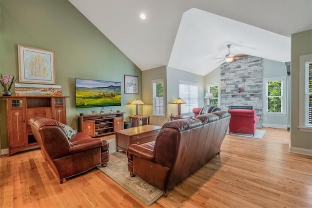 1303 Shinnecock Ct, Adams Twp, PA 16046 - living room with a ceiling fan, light wood-style flooring, a fireplace, and high vaulted ceiling
