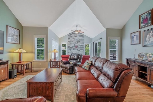 1303 Shinnecock Ct, Adams Twp, PA 16046 - living room featuring light wood finished floors, a ceiling fan, lofted ceiling, and a fireplace