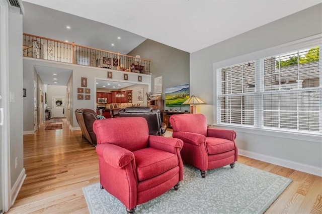 1303 Shinnecock Ct, Adams Twp, PA 16046 - living area featuring wood finished floors, recessed lighting, and high vaulted ceiling