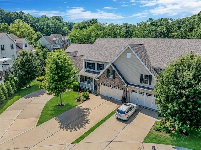 1303 Shinnecock Ct, Adams Twp, PA 16046 - view of front of home with a garage, concrete driveway, and stone siding