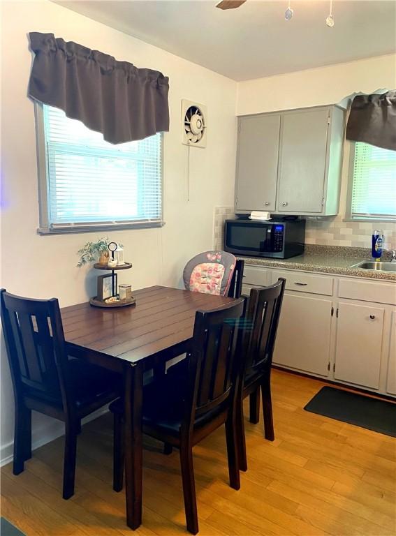 118 Delaware Ave, Scottdale, PA 15683 - dining room featuring light wood finished floors and a ceiling fan
