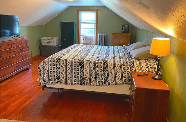118 Delaware Ave, Scottdale, PA 15683 - bedroom featuring radiator, wood finished floors, and lofted ceiling