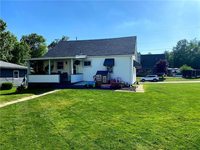 118 Delaware Ave, Scottdale, PA 15683 - rear view of house with a yard and roof with shingles
