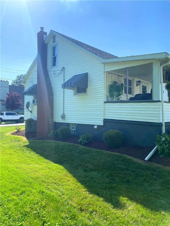 118 Delaware Ave, Scottdale, PA 15683 - view of side of home with a chimney and a yard