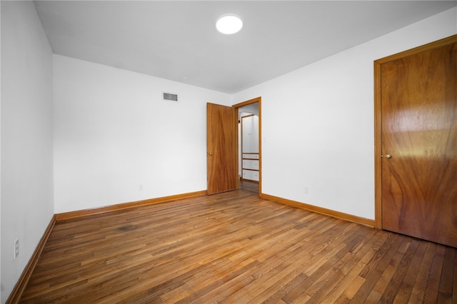 389 Mercer Rd, Hempfield Twp Mer, PA 16125 - unfurnished bedroom with hardwood / wood-style flooring and baseboards