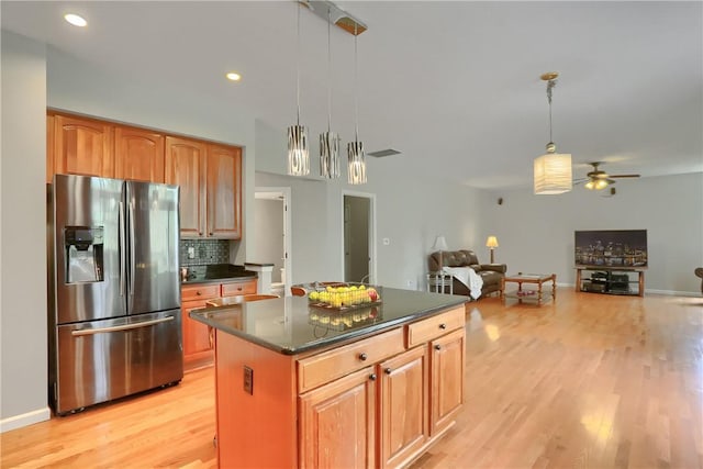 216 Beagle Dr, Moon/Crescent Twp, PA 15108 - kitchen featuring stainless steel fridge with ice dispenser, light wood-type flooring, tasteful backsplash, a ceiling fan, and open floor plan