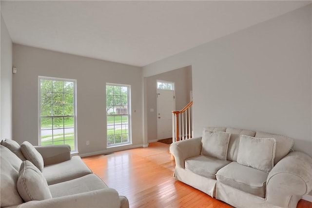 216 Beagle Dr, Moon/Crescent Twp, PA 15108 - living room with light wood finished floors and stairway