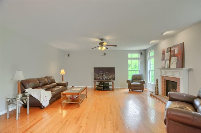 216 Beagle Dr, Moon/Crescent Twp, PA 15108 - living room with wood finished floors, a ceiling fan, and a fireplace