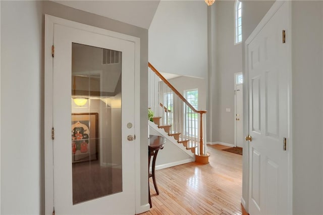 216 Beagle Dr, Moon/Crescent Twp, PA 15108 - foyer entrance featuring wood finished floors, stairs, and a towering ceiling
