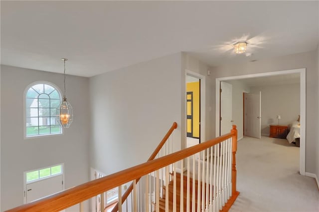 216 Beagle Dr, Moon/Crescent Twp, PA 15108 - hall with an upstairs landing, a chandelier, and light carpet