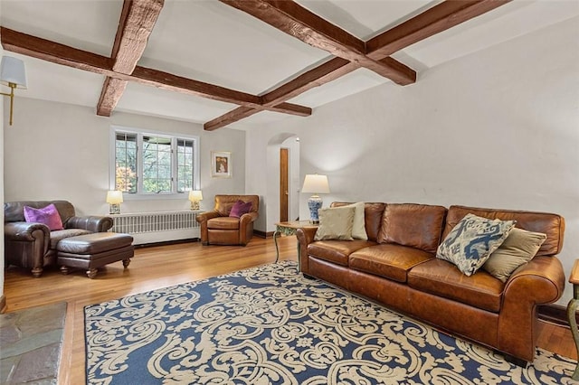 234 Orchard Dr, Mt Lebanon, PA 15228 - living area featuring coffered ceiling, wood finished floors, arched walkways, radiator, and beam ceiling