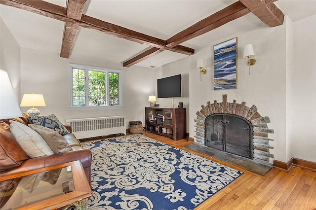 234 Orchard Dr, Mt Lebanon, PA 15228 - living room featuring radiator, hardwood / wood-style floors, a fireplace with raised hearth, beamed ceiling, and coffered ceiling