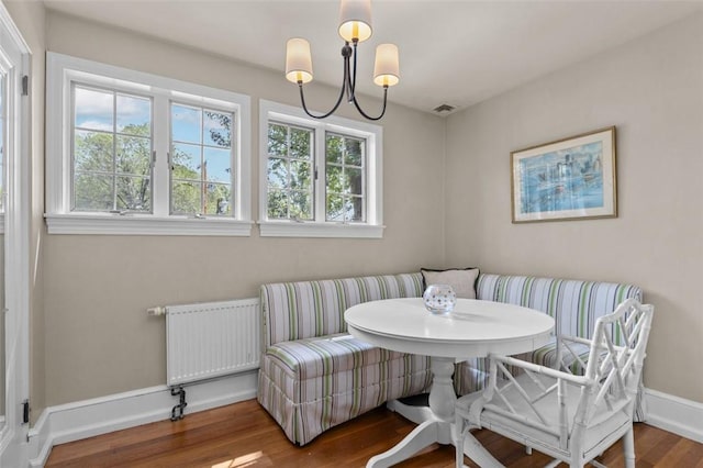234 Orchard Dr, Mt Lebanon, PA 15228 - dining area featuring radiator heating unit, breakfast area, wood finished floors, and plenty of natural light