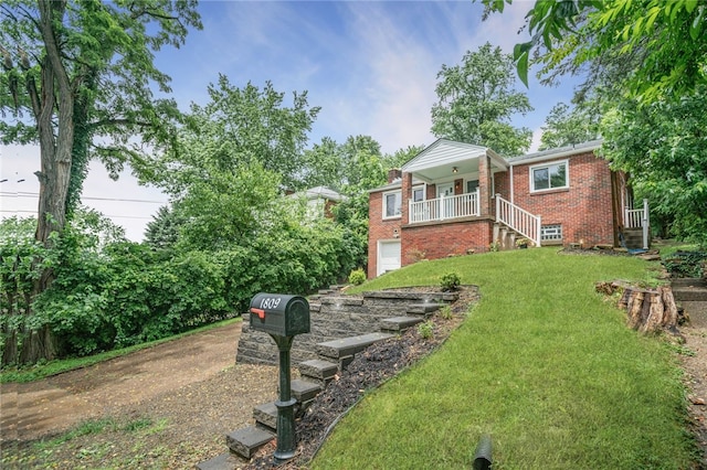 1809 Rosedale St, Verona, PA 15147 - view of front of property featuring brick siding, a front lawn, an attached garage, stairs, and covered porch