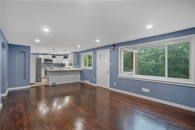 1809 Rosedale St, Verona, PA 15147 - unfurnished living room featuring wood finished floors and recessed lighting