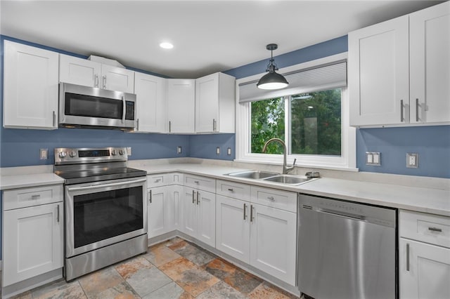 1809 Rosedale St, Verona, PA 15147 - kitchen with stainless steel appliances, light countertops, white cabinets, light stone finish flooring, and recessed lighting