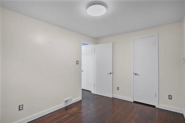 1809 Rosedale St, Verona, PA 15147 - unfurnished bedroom with dark wood-style flooring and baseboards