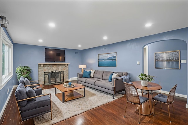 1809 Rosedale St, Verona, PA 15147 - living area with arched walkways, wood finished floors, recessed lighting, and a stone fireplace