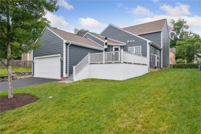 900 Thorn St, Sewickley, PA 15143 - view of front of house featuring an attached garage, a deck, asphalt driveway, roof with shingles, and a chimney