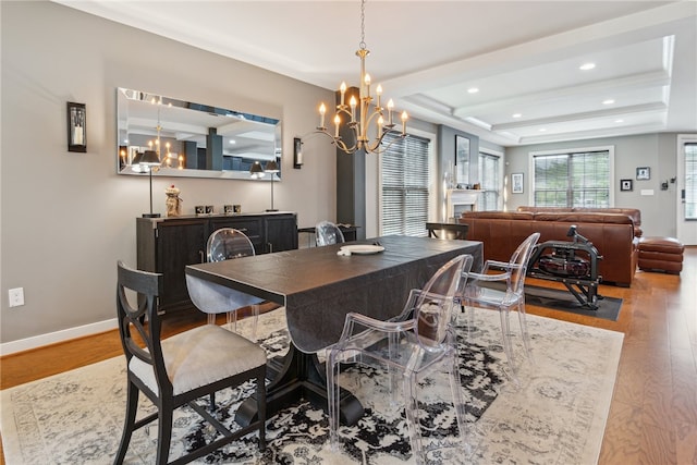 900 Thorn St, Sewickley, PA 15143 - dining room with wood finished floors, a chandelier, a raised ceiling, and recessed lighting