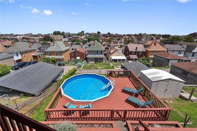 811 Bayridge Ave, Brookline, PA 15226 - view of swimming pool featuring a shed, a wooden deck, and a residential view