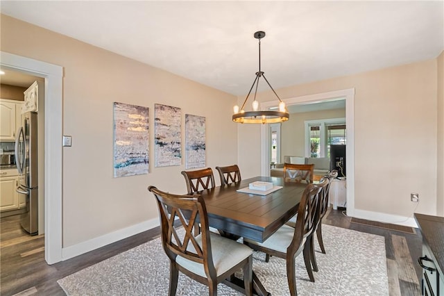811 Bayridge Ave, Brookline, PA 15226 - dining area with dark wood-style flooring and a chandelier