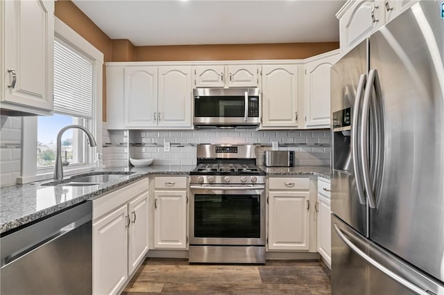 811 Bayridge Ave, Brookline, PA 15226 - kitchen featuring stainless steel appliances, white cabinetry, light stone countertops, and tasteful backsplash